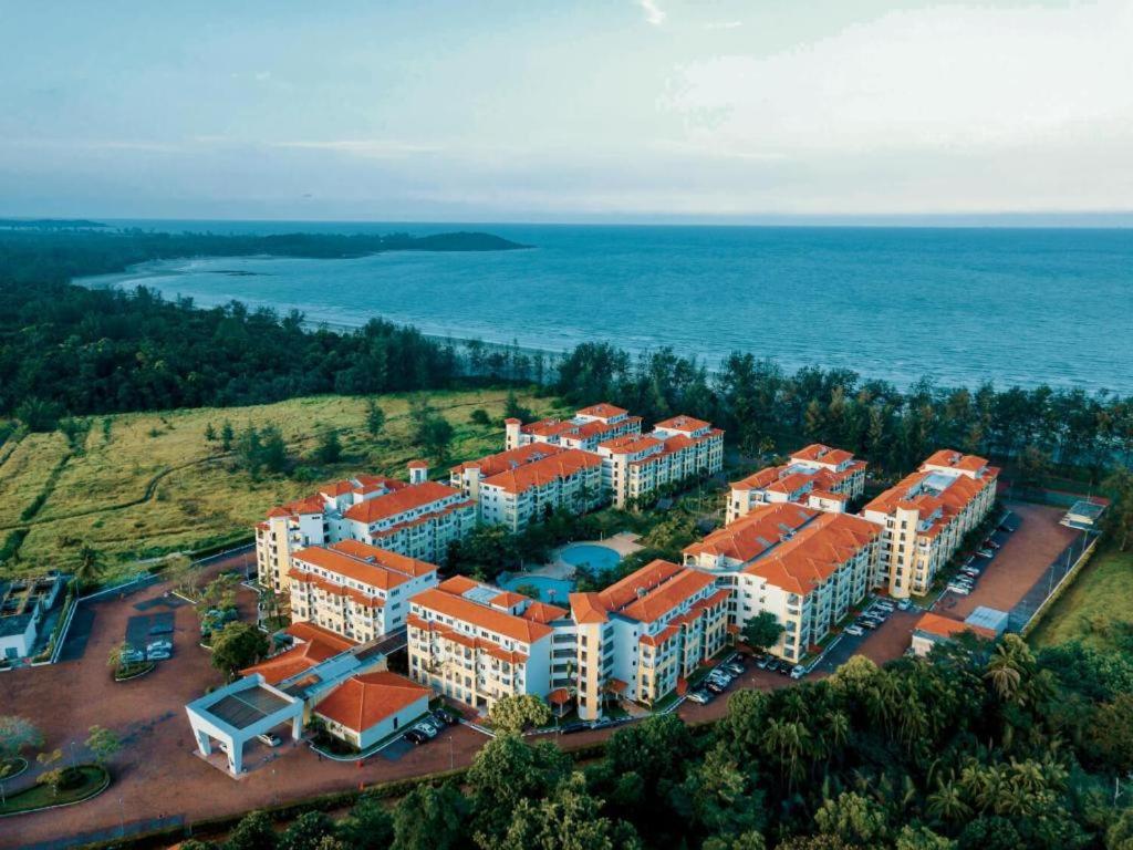 an aerial view of a building near the water at Desaru Private Beach VIP Family Suite NetFlix in Bandar Penawar