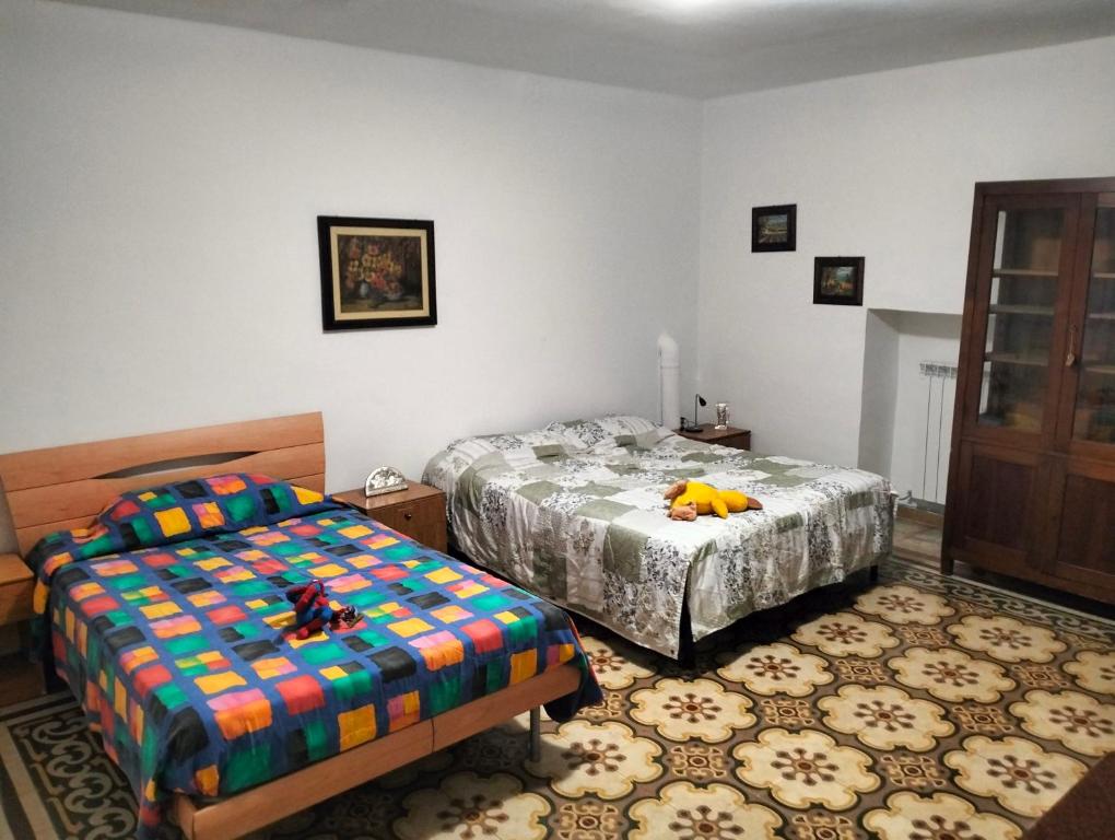 מיטה או מיטות בחדר ב-La Casa Del Corso