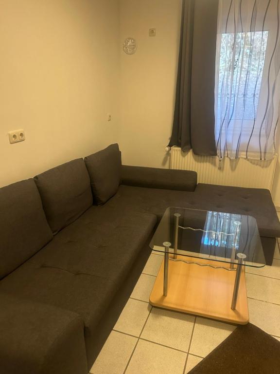 a living room with a couch and a coffee table at Ferienwohnung Siegen Eiserfeld 5 in Siegen