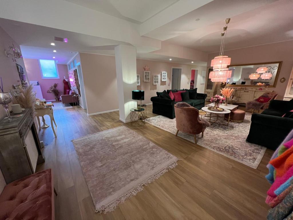 a living room with a couch and a table at Der Salon Hostel in Vienna