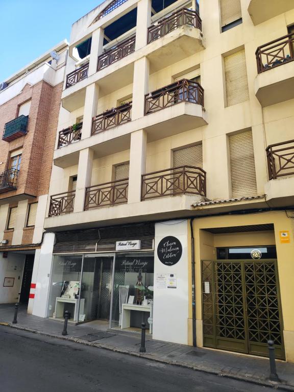 a building on a city street with a store at La Florida in Ciudad Real