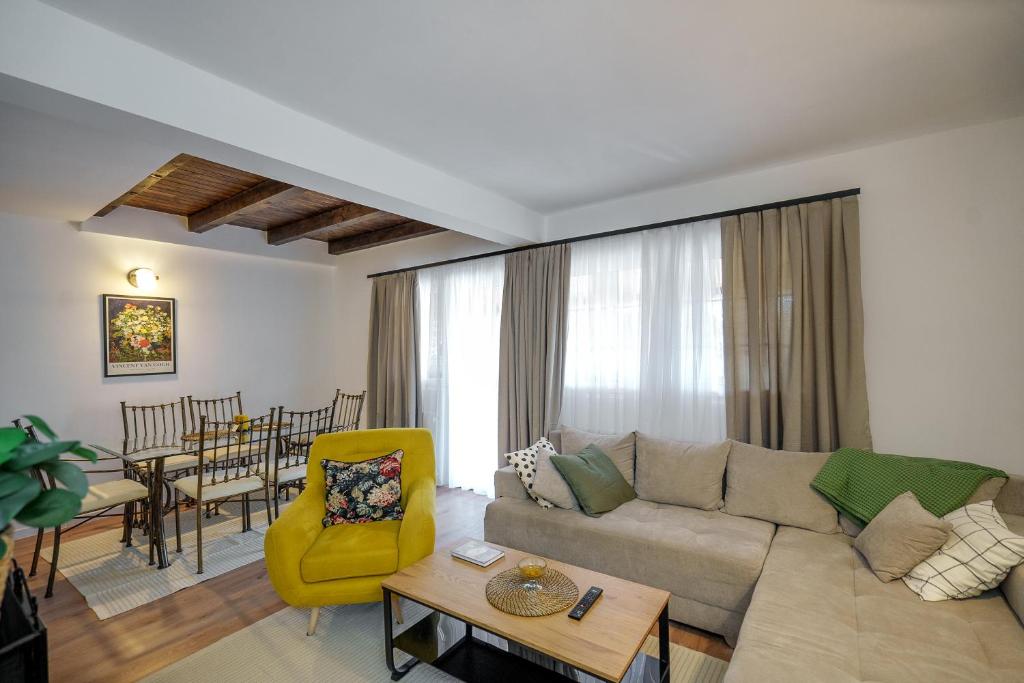 a living room with a couch and a table at The Greens Family House in Zlatibor