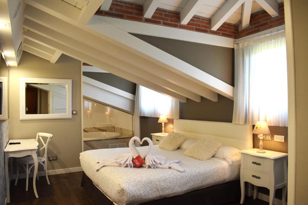 Cama o camas de una habitación en Hotel Spa San Marcos