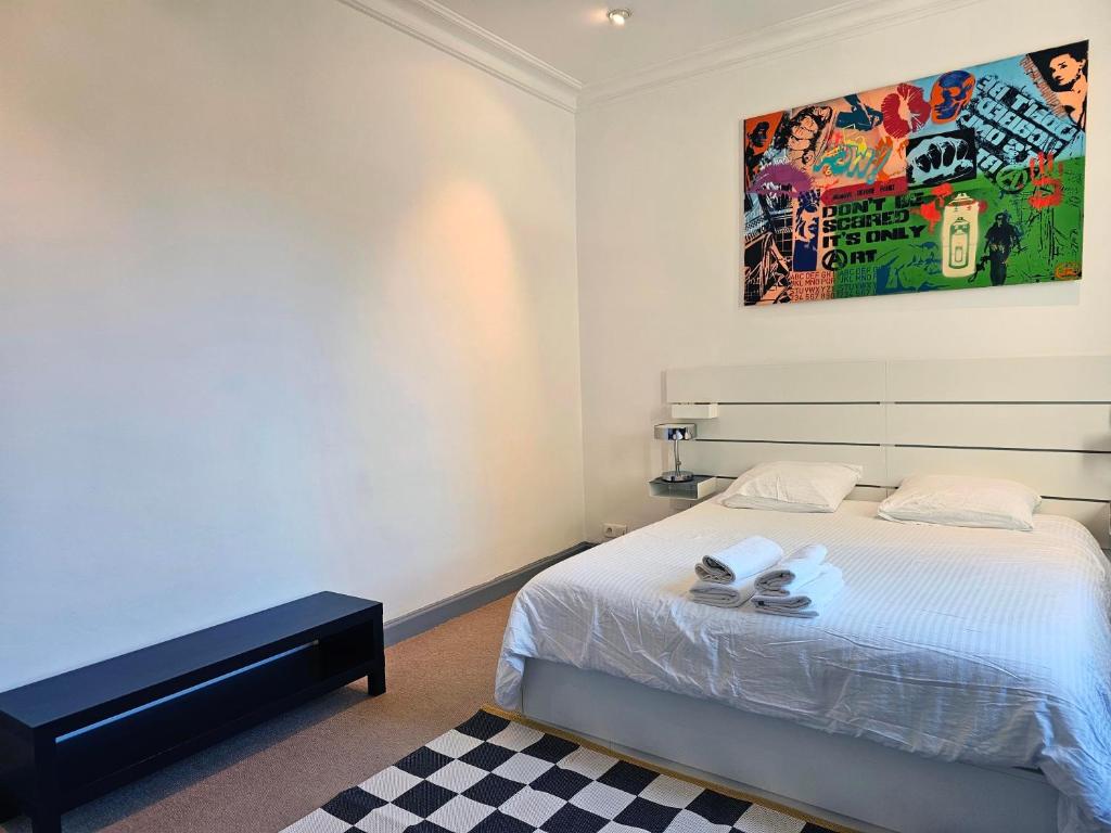 Postel nebo postele na pokoji v ubytování L'Idrac, Appartements en Hyper centre