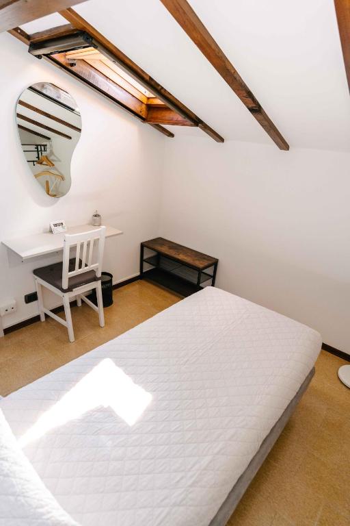 Łóżko lub łóżka w pokoju w obiekcie B&B Spina Verde