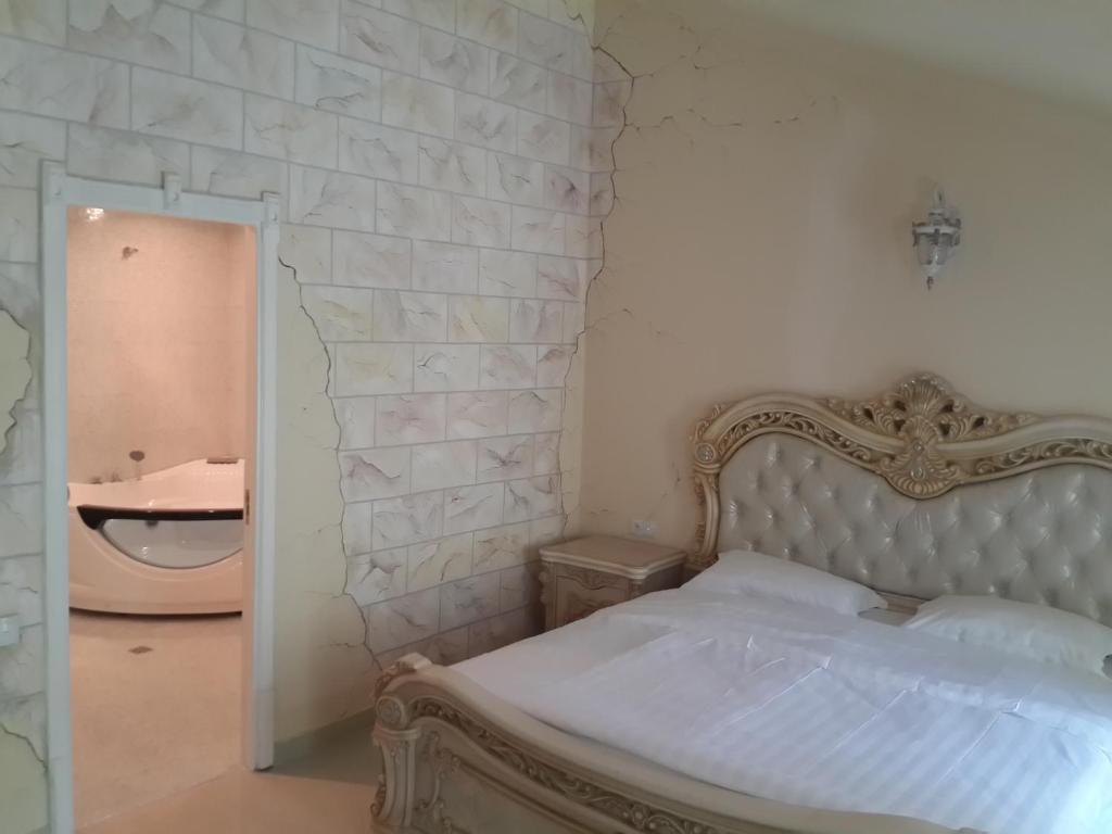 Postel nebo postele na pokoji v ubytování Venezia Palazzo Hotel