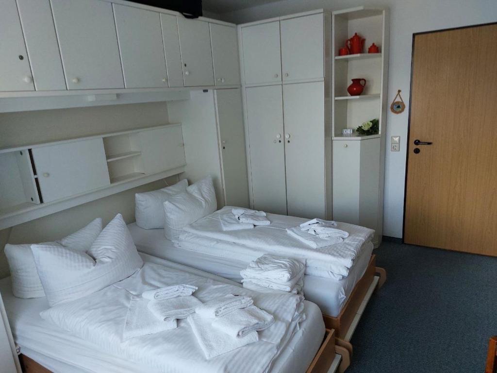 Postel nebo postele na pokoji v ubytování Ferienidyll Langeoog