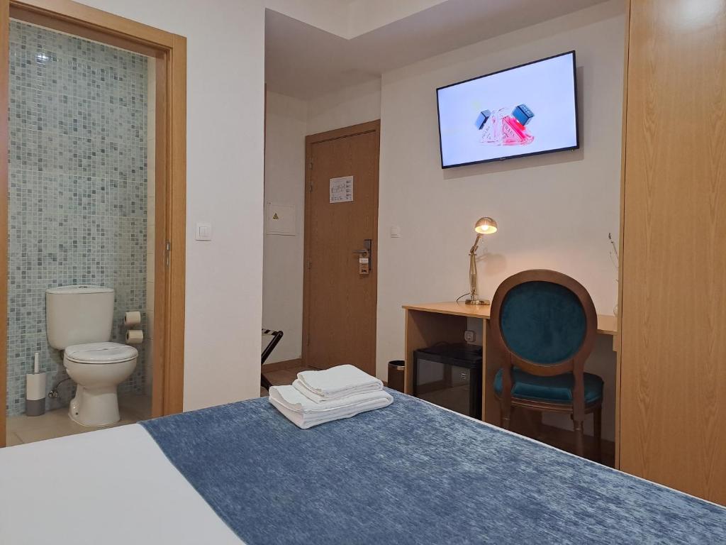 Ein Bett oder Betten in einem Zimmer der Unterkunft Hotel SQUARE