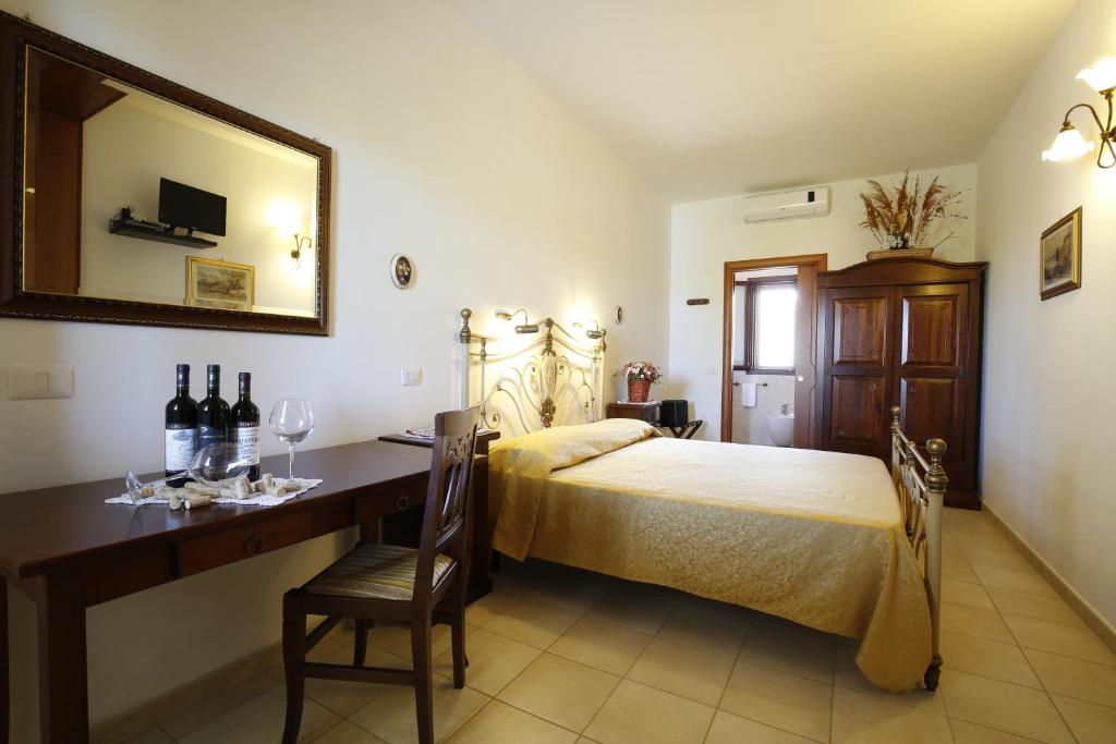 Łóżko lub łóżka w pokoju w obiekcie Agriturismo Posta Pastorella