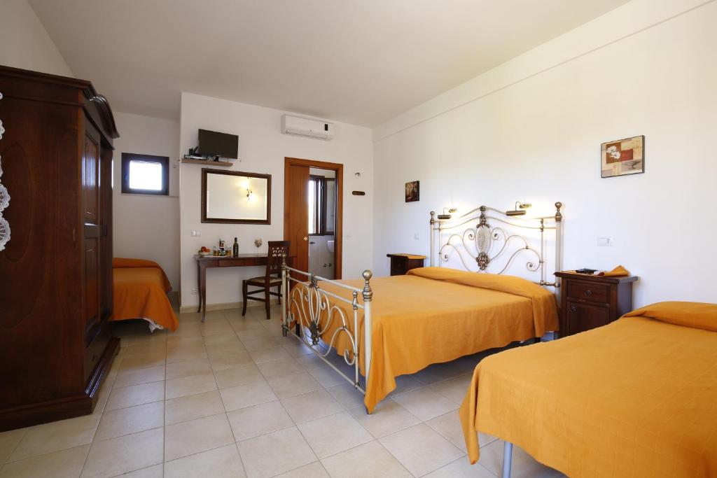 Łóżko lub łóżka w pokoju w obiekcie Agriturismo Posta Pastorella