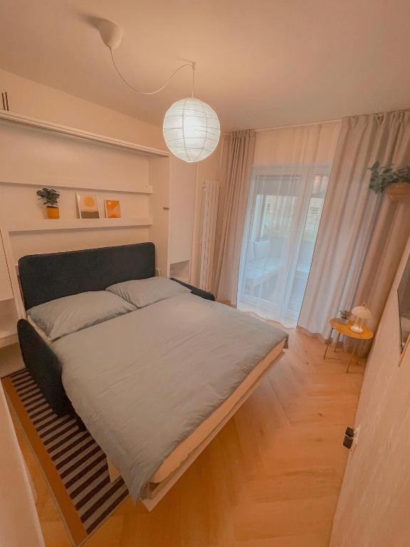 Postel nebo postele na pokoji v ubytování NØDA - Nørdic Design Apartment with Terrace