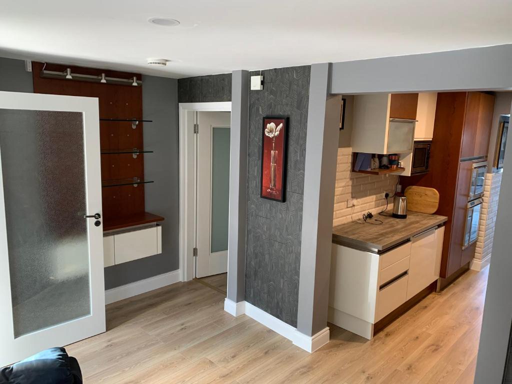 a kitchen with wooden cabinets and a counter top at Seventy Eight in Wexford