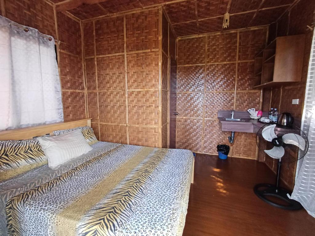 Postel nebo postele na pokoji v ubytování Almare Guest House Siquijor