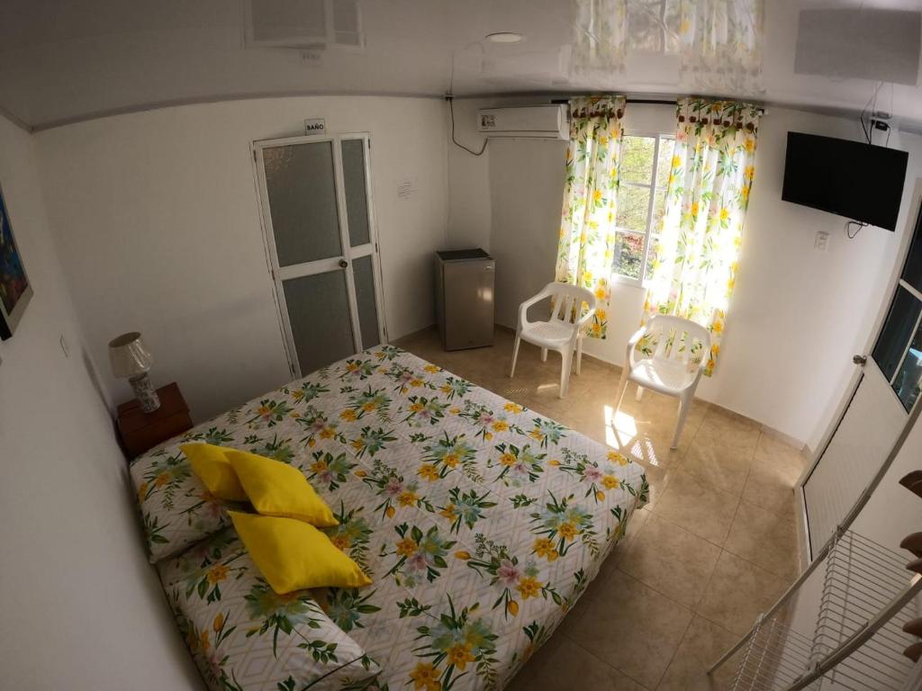 Postel nebo postele na pokoji v ubytování Native Lodge Brisas del Sur