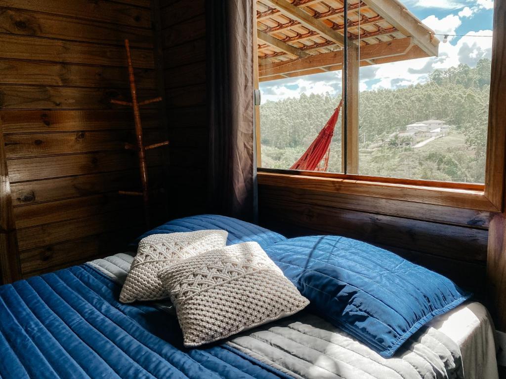 Säng eller sängar i ett rum på Sitio Ancestrale - Melhor lugar de Santa Teresa-ES