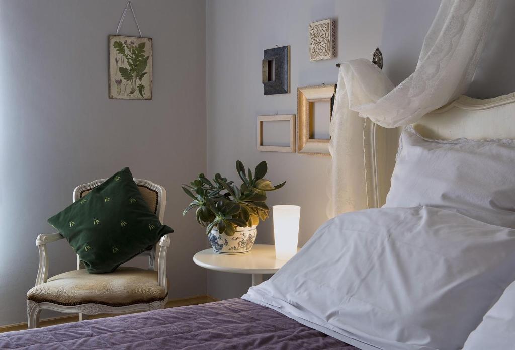 Łóżko lub łóżka w pokoju w obiekcie B&B La Cuntana
