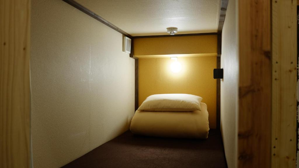 Postel nebo postele na pokoji v ubytování Hostel Furoya