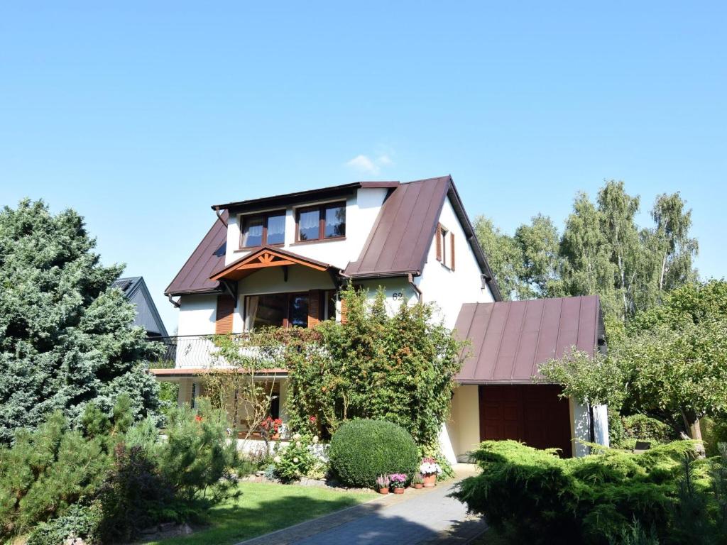 a house with a brown roof at Spacious holiday home in Kopalino in Kopalino