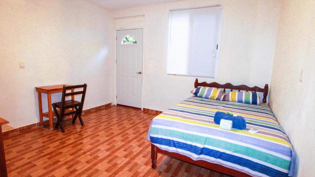 Postel nebo postele na pokoji v ubytování Hotel Vias Maya Bacalar