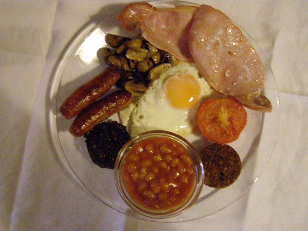 a plate of breakfast food with eggs beans and meat at Killurin Lodge in Wexford