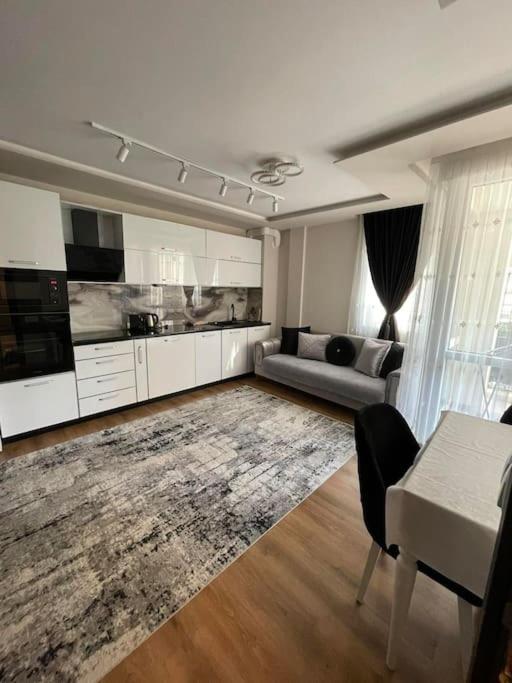 a living room with a couch and a table at Luxury Flat-4 People-Mladost in Varna City