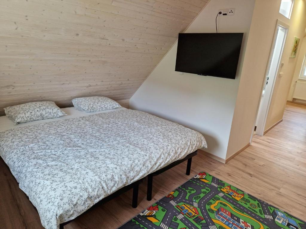 Postel nebo postele na pokoji v ubytování Lipovka