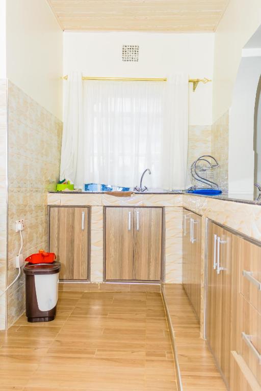 Kuchyň nebo kuchyňský kout v ubytování Homely Escapes