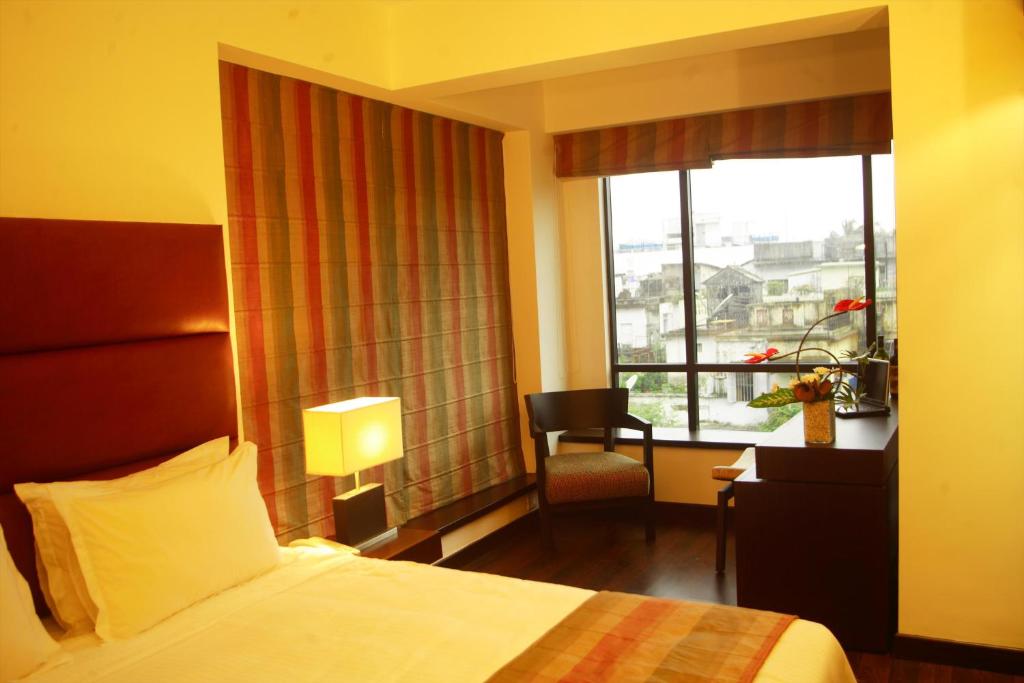 Postel nebo postele na pokoji v ubytování Hotel Metropole