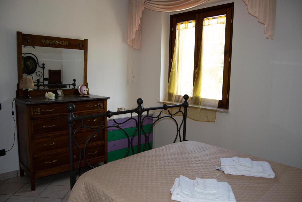 Postel nebo postele na pokoji v ubytování Residenza Il Conte