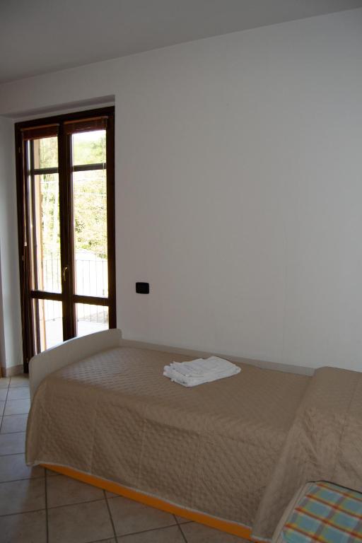 Postel nebo postele na pokoji v ubytování Residenza Il Conte