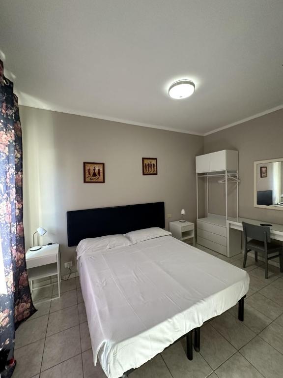Postel nebo postele na pokoji v ubytování Hotel Le Rose