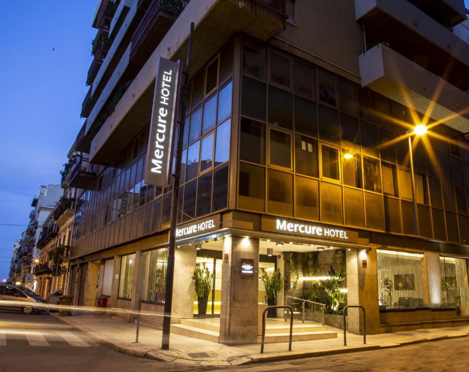 a store front of a building on a street at Mercure Palermo Centro in Palermo