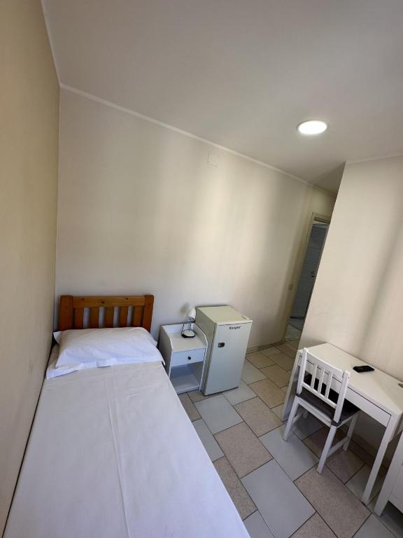 Postel nebo postele na pokoji v ubytování Hotel Le Rose