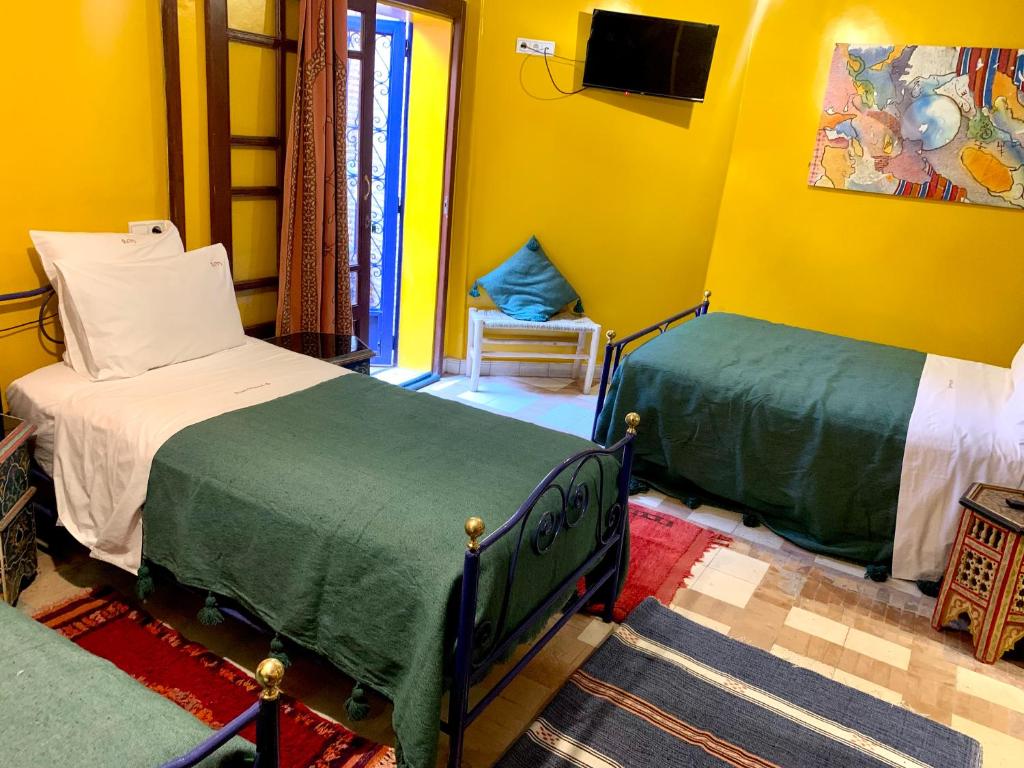 Postel nebo postele na pokoji v ubytování Riad Mazal