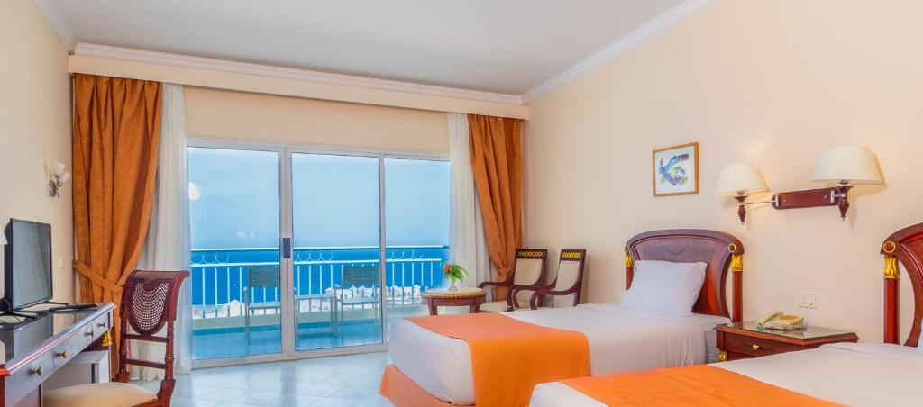 Postel nebo postele na pokoji v ubytování Siva Golden Bay Makadi