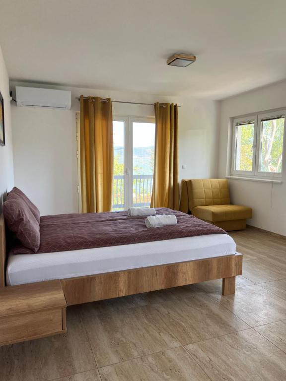 Postel nebo postele na pokoji v ubytování Apartmani PORTO