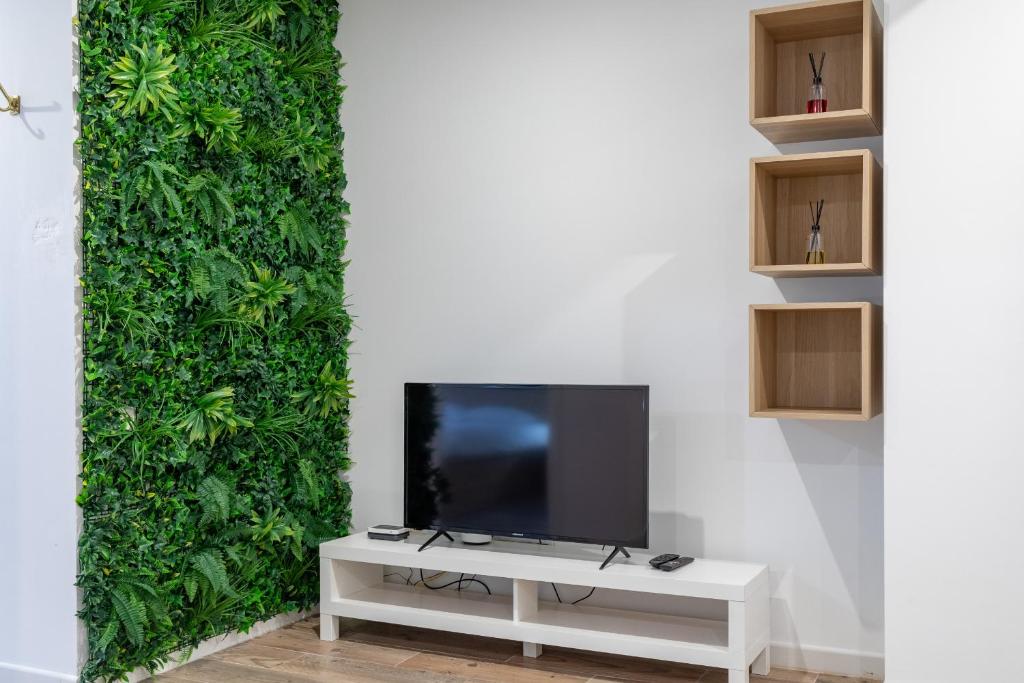 Televízia a/alebo spoločenská miestnosť v ubytovaní ApartUP Ruzafa Vertical