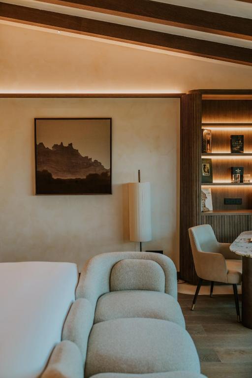Postel nebo postele na pokoji v ubytování Gran Hotel Mas d'en Bruno