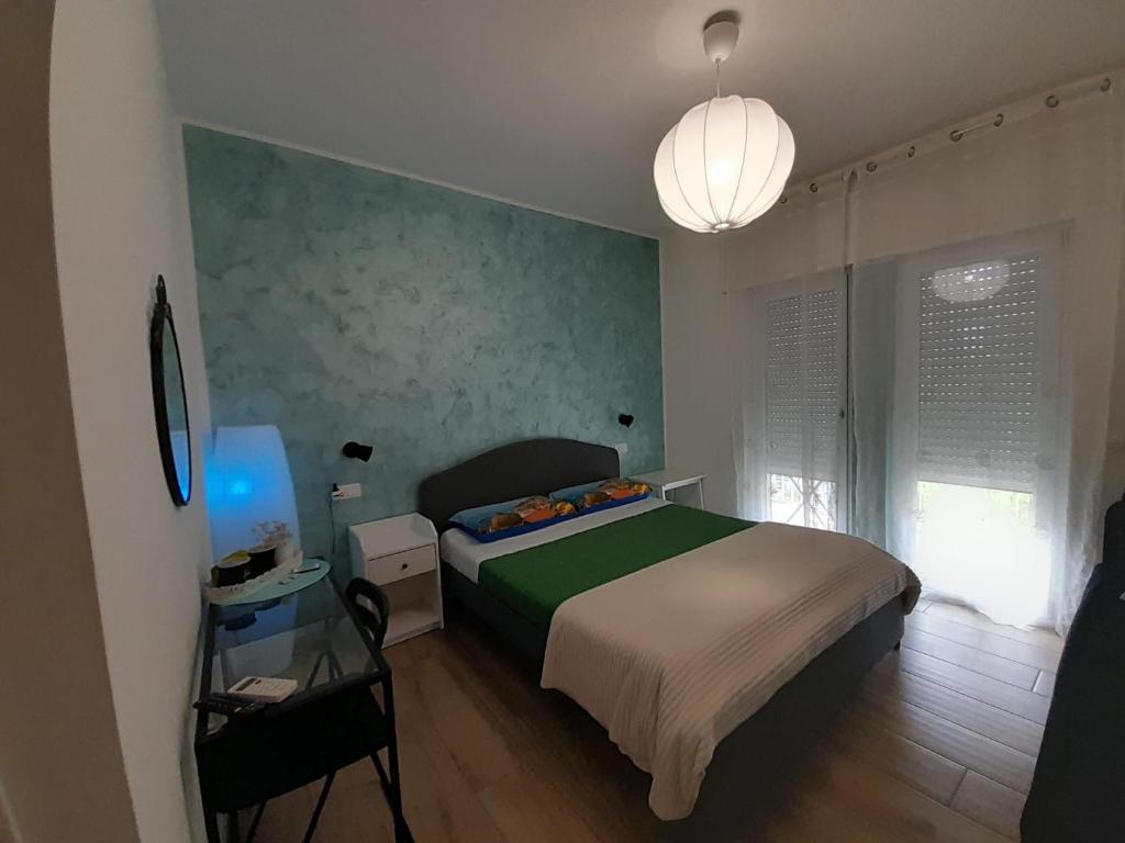 Postel nebo postele na pokoji v ubytování ARIEL ROOMS