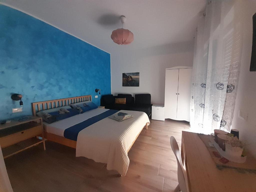 Postel nebo postele na pokoji v ubytování ARIEL ROOMS