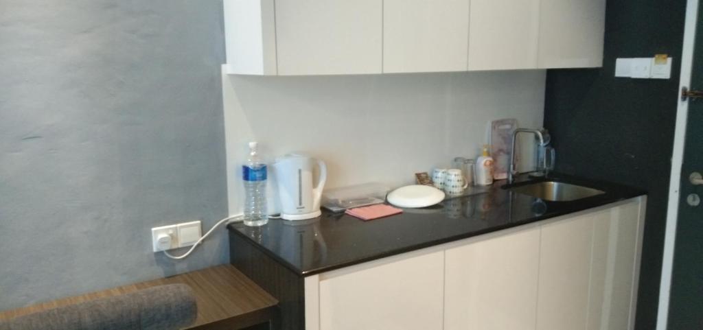 Kuchyň nebo kuchyňský kout v ubytování Pintarman Service Apartment