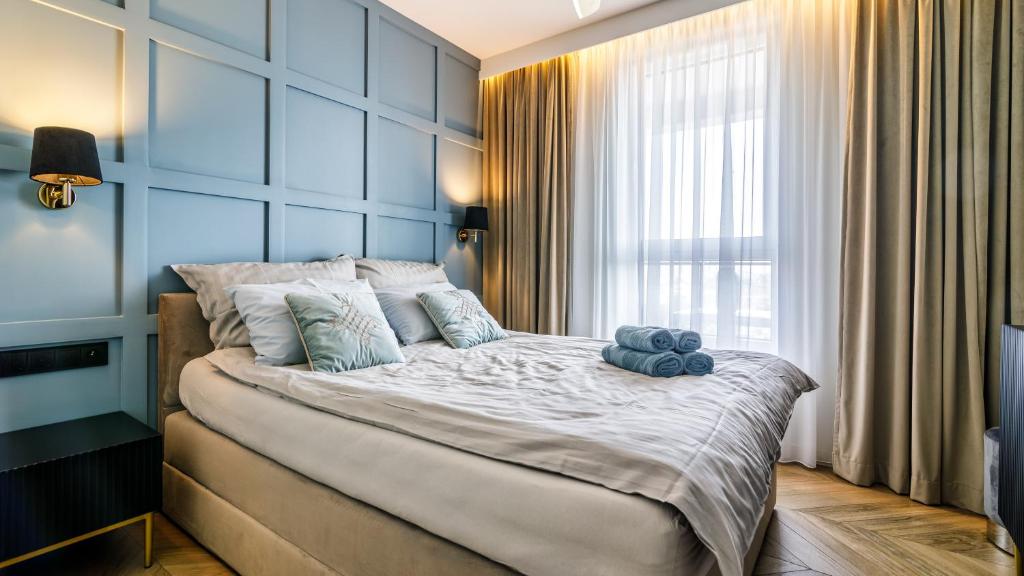 Posteľ alebo postele v izbe v ubytovaní Baltic Premium Apartment z klimatyzacją ZASPA VVITA