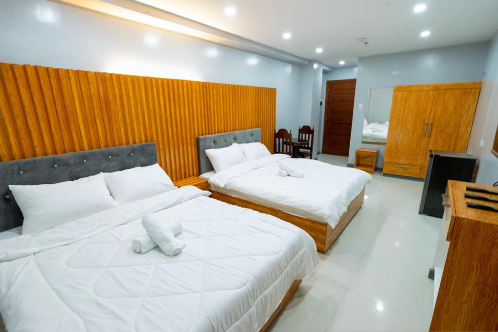 Postel nebo postele na pokoji v ubytování Grand Mercy Hotel