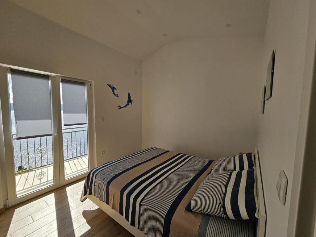 Posteľ alebo postele v izbe v ubytovaní Sea view Apartment