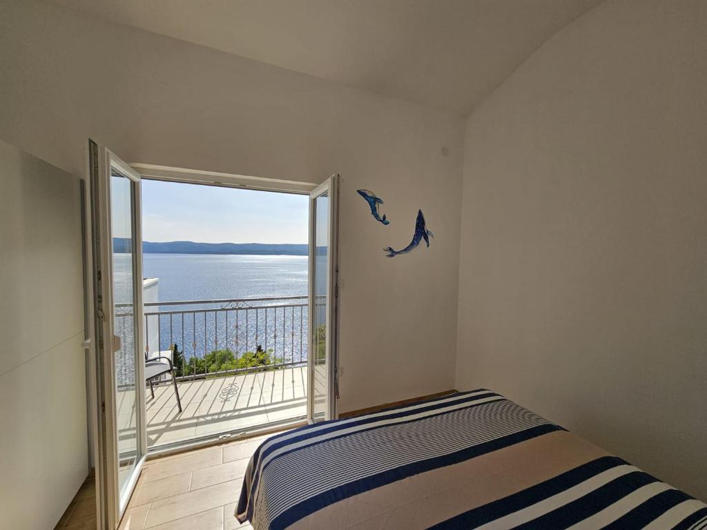 Posteľ alebo postele v izbe v ubytovaní Sea view Apartment