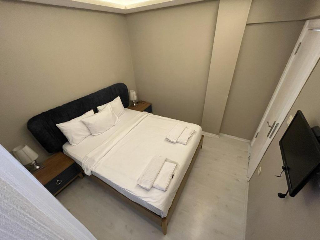 Postel nebo postele na pokoji v ubytování Golden Gate Hotel Topkapı