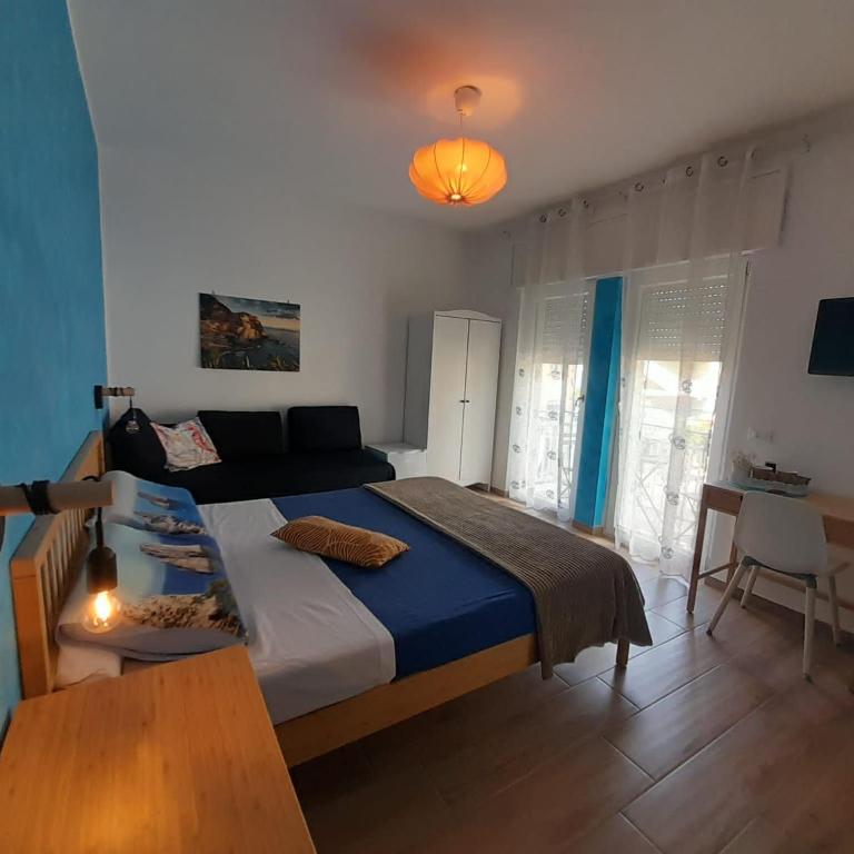 Postel nebo postele na pokoji v ubytování ARIEL ROOMS
