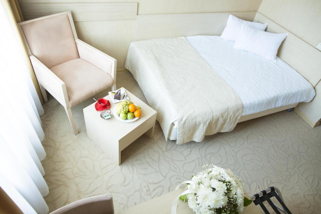 Кровать или кровати в номере Бизнес-Отель Дельта