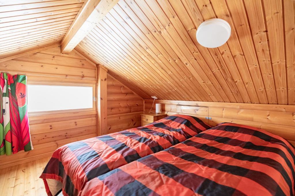 Postel nebo postele na pokoji v ubytování Pyhä Nallentupa