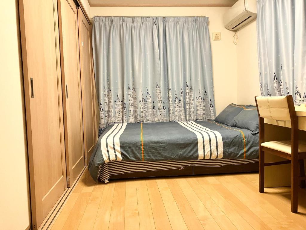 Un ou plusieurs lits dans un hébergement de l'établissement 新規OPEN8割！1棟貸切・10名可能！秋葉原まで13分、新宿まで32分／スカイツリー近く